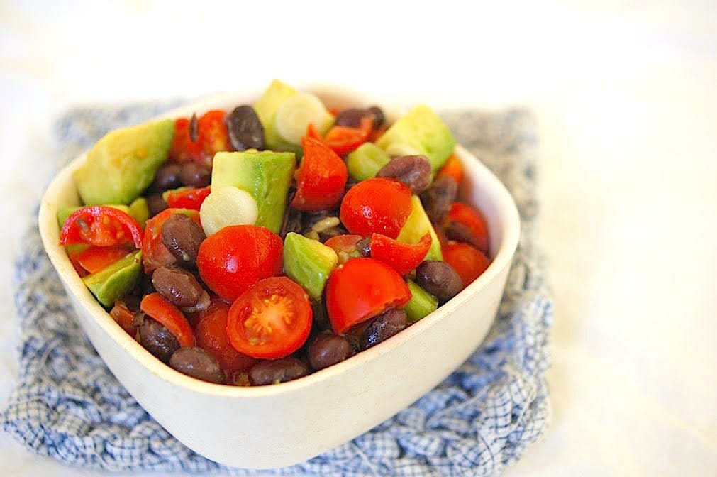 salad of avocado, beans, and tomatoes for toddlers