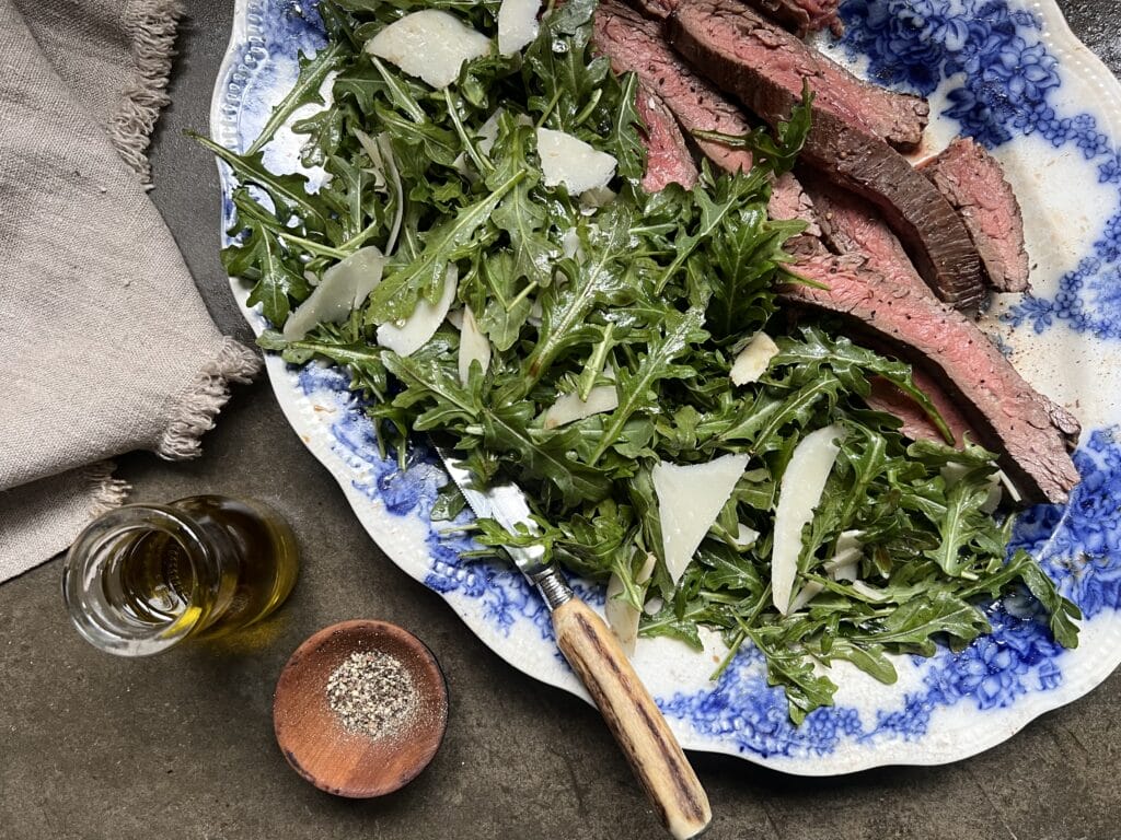 steak on arugula