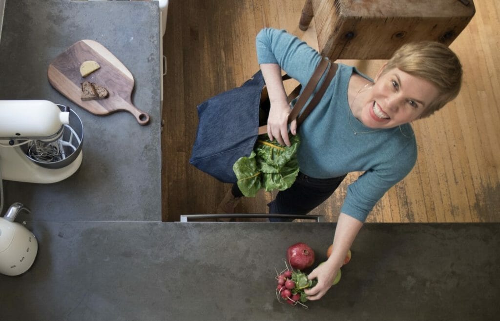 Kate morford with groceries in her kitchen