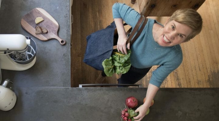 Kate morford with groceries in her kitchen