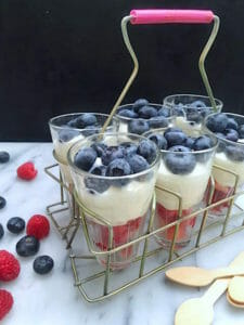 Raspberry and Blueberry Parfait of whipped cream and Greek yogurt