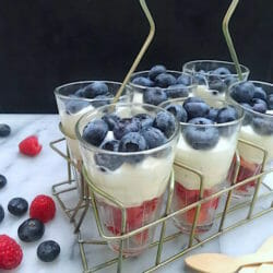 Raspberry and Blueberry Parfait of whipped cream and Greek yogurt