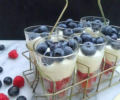 Raspberry and Blueberry Parfait of whipped cream and Greek yogurt