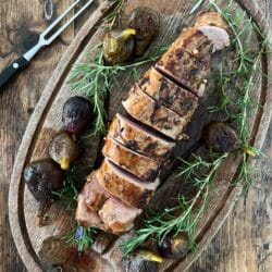 Sliced pork tenderloin on a cutting board