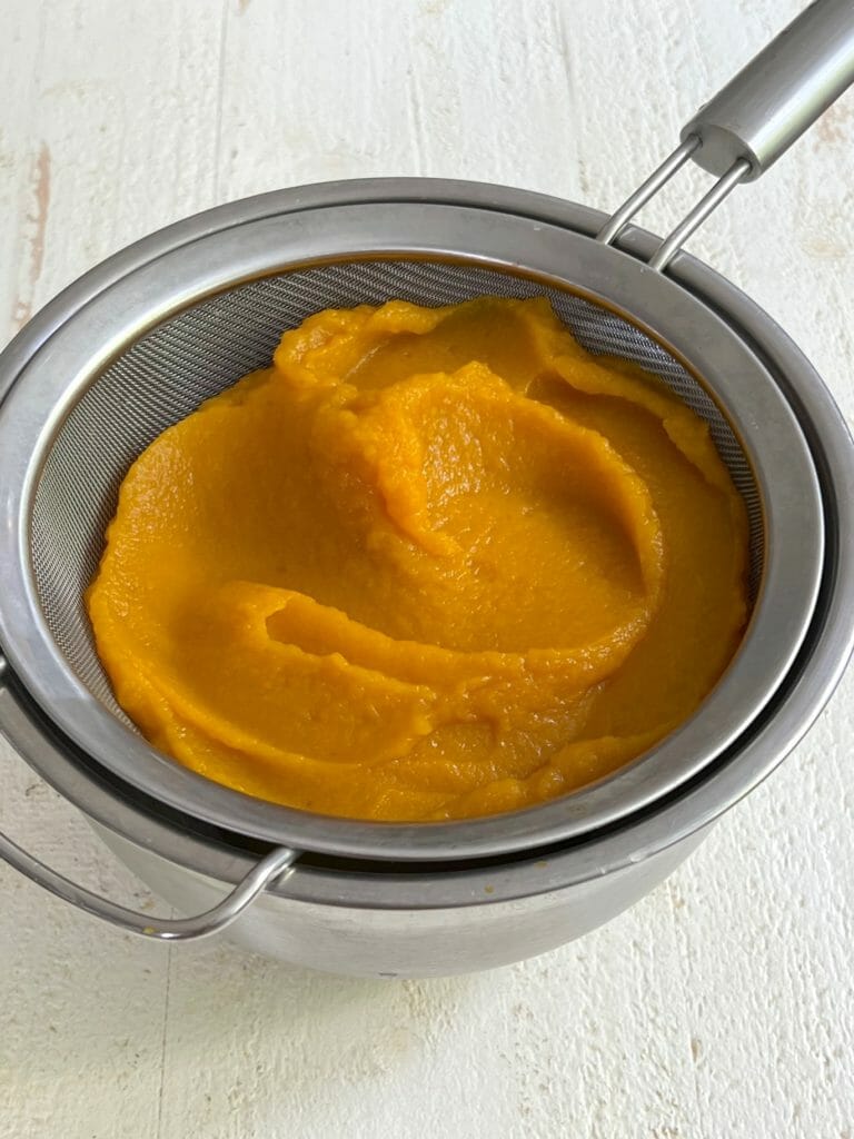 Pumpkin puree in a strainer