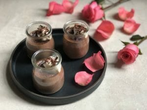3 Glass jars of Light Chocolate Pot de Creme with pink rose petals