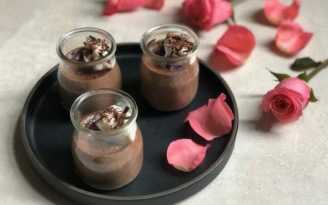 3 Glass jars of Light Chocolate Pot de Creme with pink rose petals