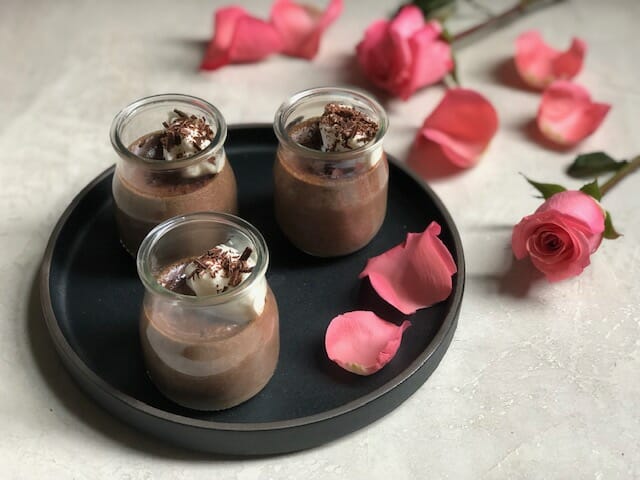 3 Glass jars of Light Chocolate Pot de Creme with pink rose petals 