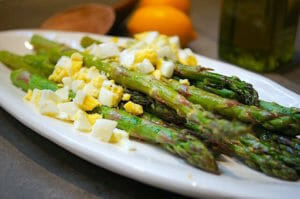 Roasted Asparagus on a plate with chopped egg on top