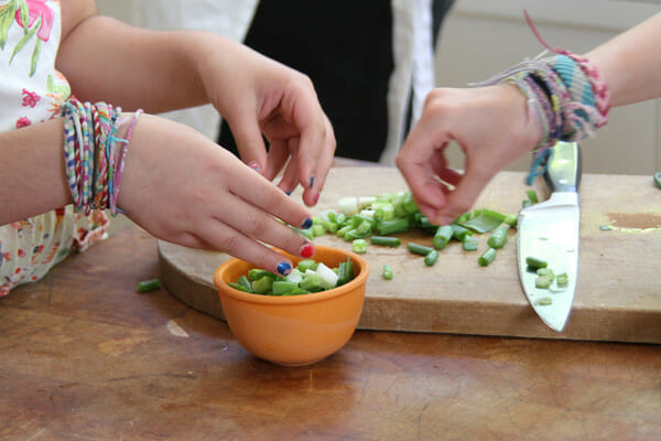 little hands chopping herbs