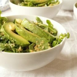 Salad in a white bowl with avocado and quinoa. Healthy anti-inflammatory recipe