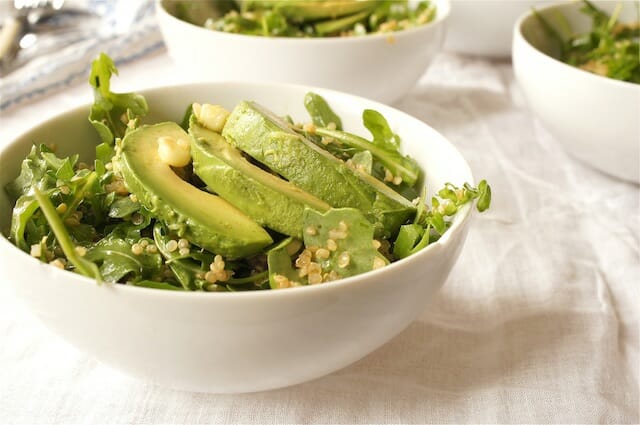 Salad in a white bowl with avocado and quinoa. Healthy anti-inflammatory recipe