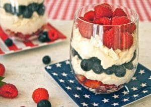 Eton Mess in a glass with strawberries, blueberries, and raspberries