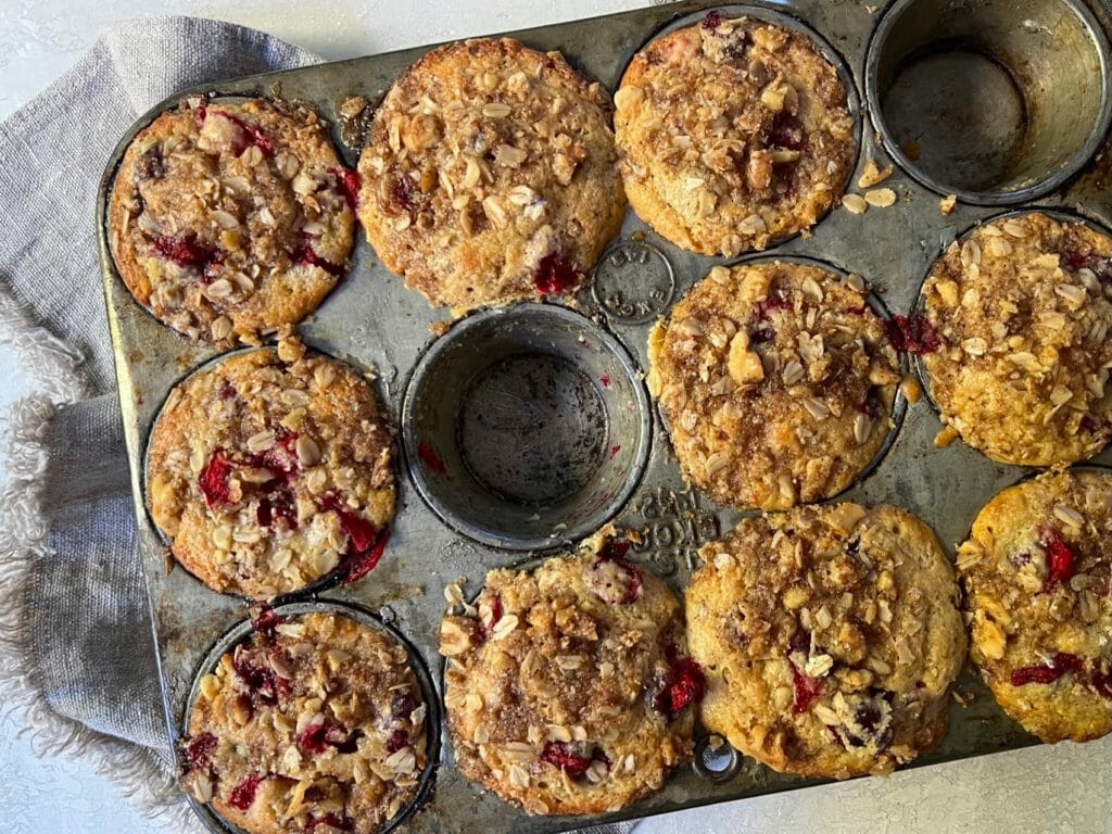 muffin tin of cranberry muffins
