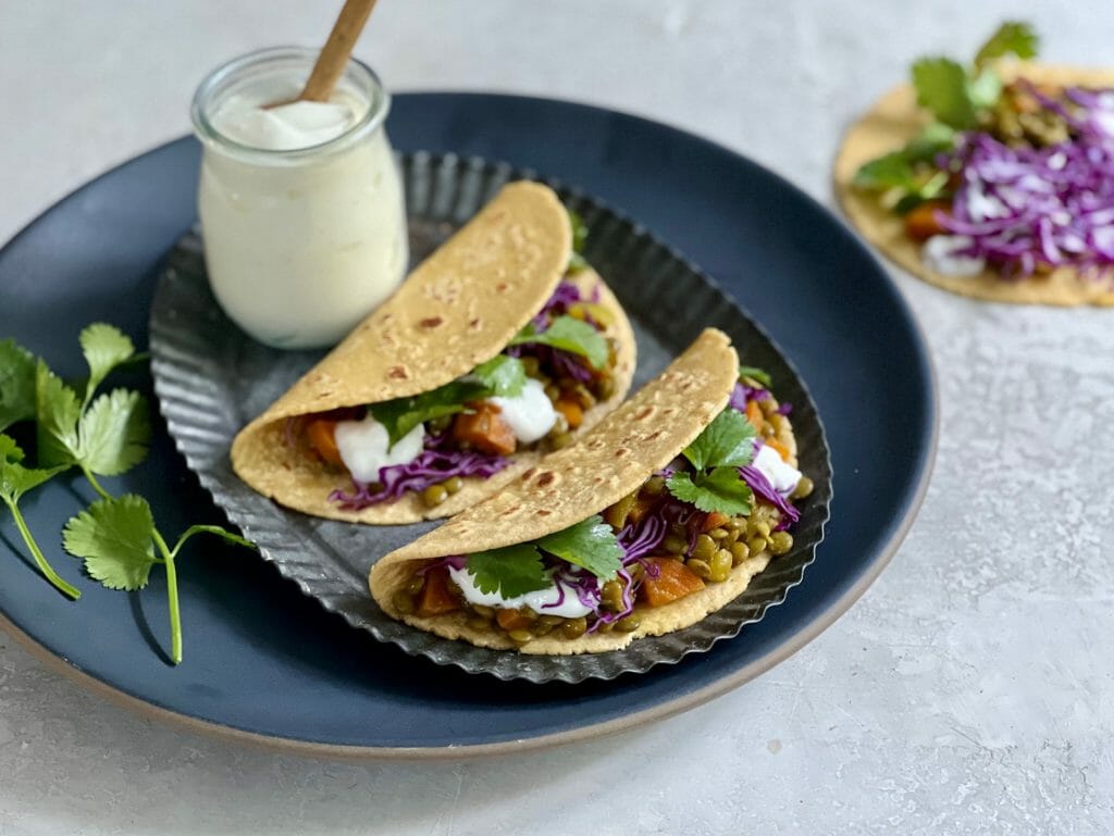 two lentil tacos with yogurt and cilantro