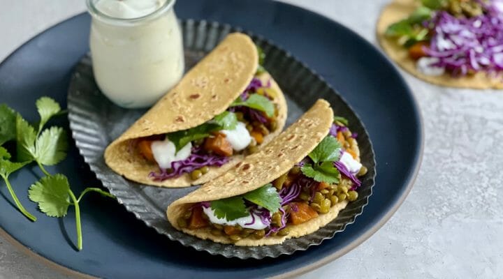 two lentil tacos with yogurt and cilantro