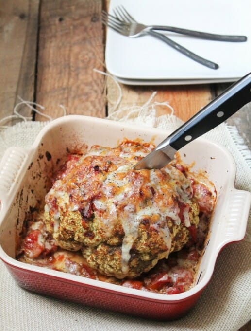 Whole-Roasted-Cauliflower-with-pesto-and-tomatoes-779x1024