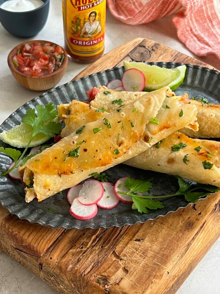 Baked chicken taquitos with hot sauce