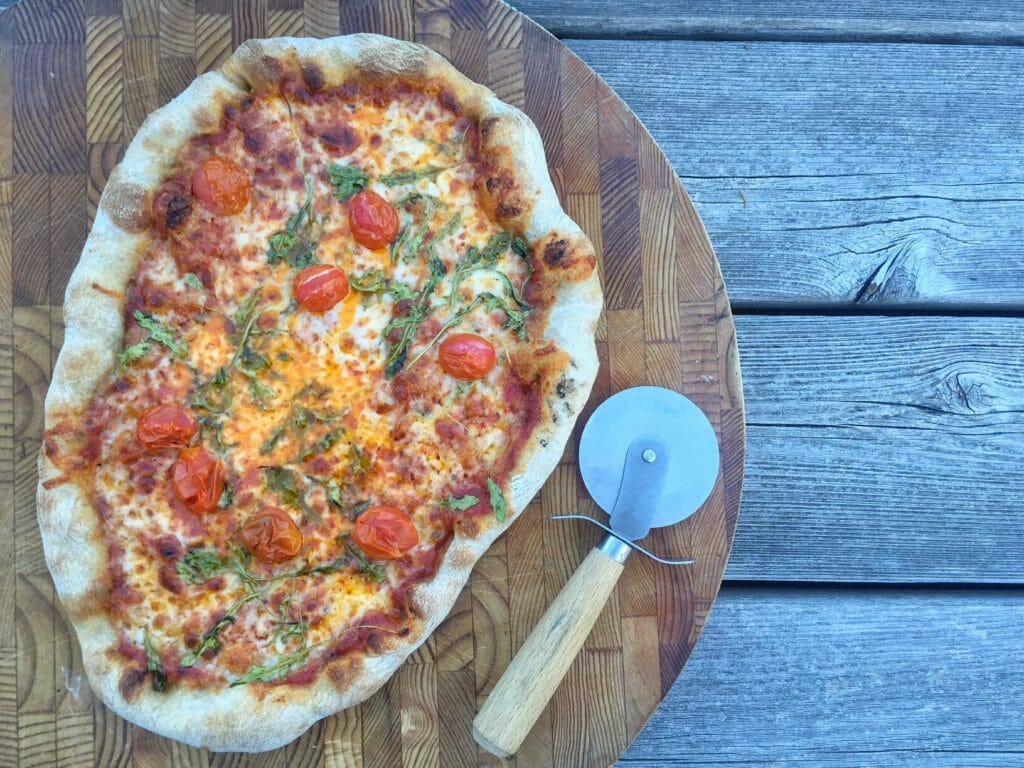 pizza on a cutting board