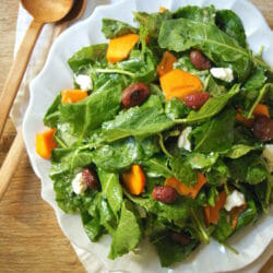 Winter Kale Salad with Roasted Grapes, Persimmons, and Goat Cheese