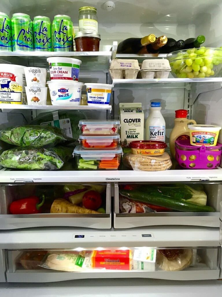 Inside of a refrigerator and 10 ways to stop food waste