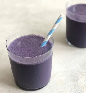 Wild Blueberry Smoothie with a striped blue straw