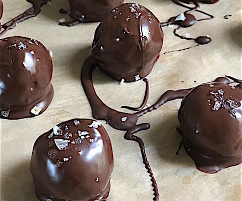 Ginger Walnut Date Truffles with chocolate drizzle