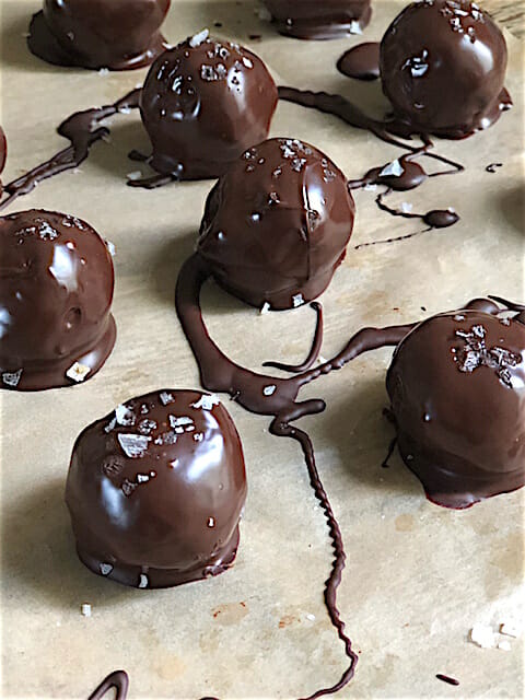Ginger Walnut Date Truffles with chocolate drizzle