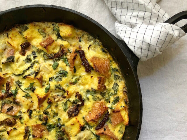 mediterranean strata in a cast iron skillet