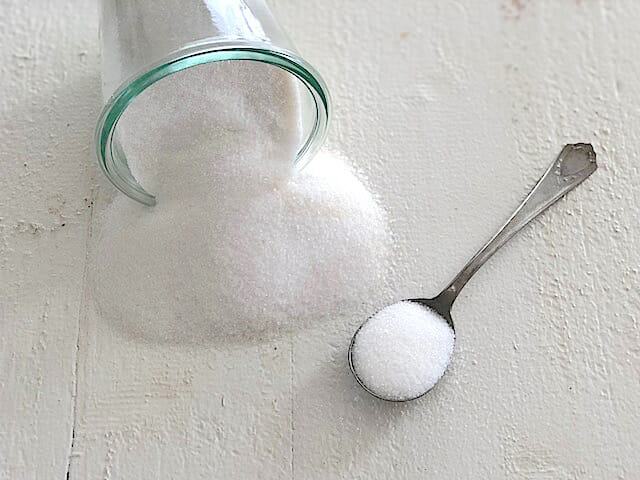 Sugar spilled on the counter as part of healthy store bought snacks