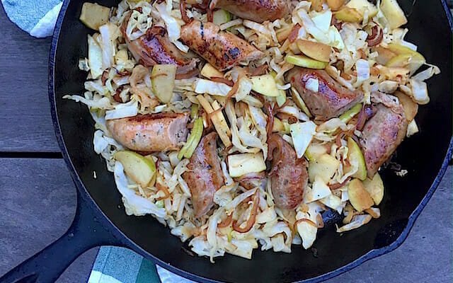 skillet of sausage cabbage and apples