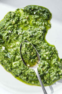 Green herb sauce with a spoon