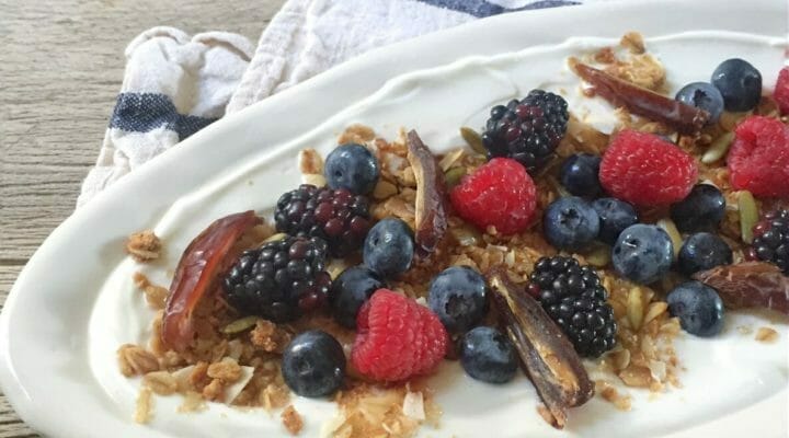 20 tasty heart healthy foods including  yogurt parfait on a plate