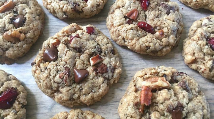 Cowboy cookies on a piece of white parchment paper