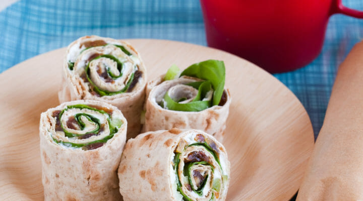 tips for easy school (and work) lunches starting with a wrap with thermos of milk