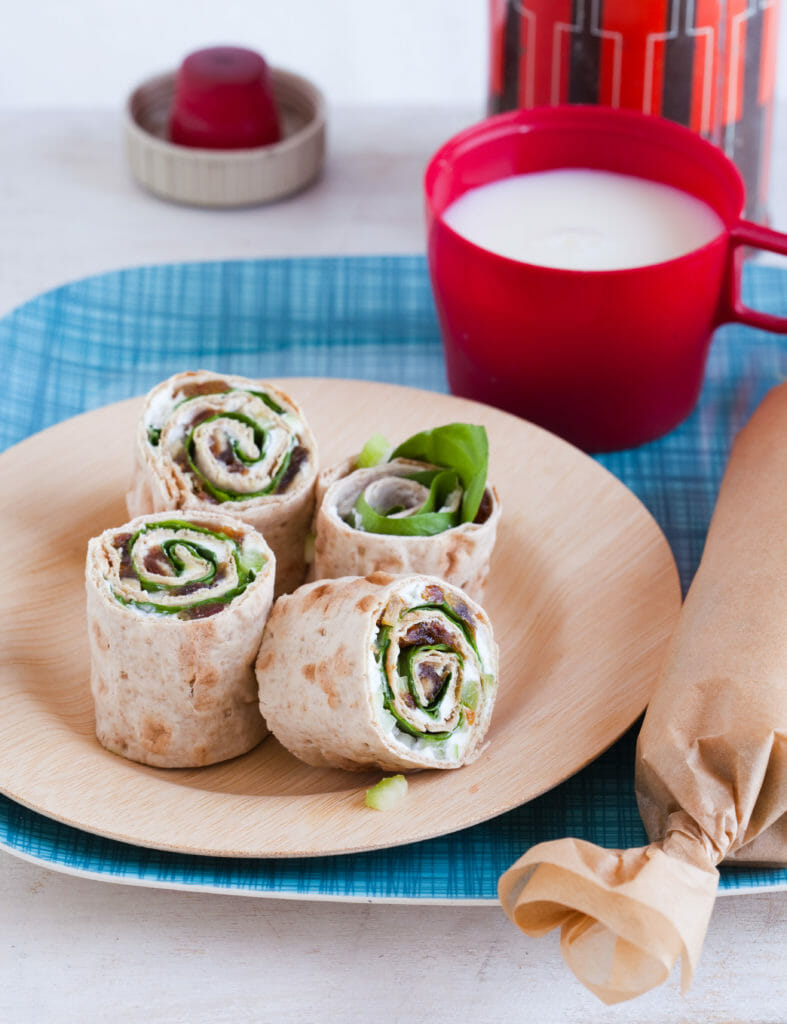 tips for easy school (and work) lunches starting with a wrap with thermos of milk