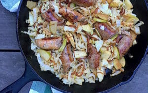 Sausage with cabbage and apples