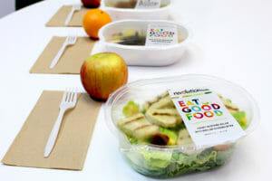 school lunch salad in container with apple