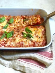 Casserole with spatula in Oven Baked Vegetarian Tofu Parmigiana