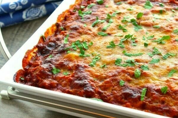 spaghetti squash lasagna in a white casserole dish, close up