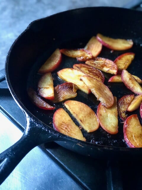 Cast iron skillet of apples for pork chop recipe