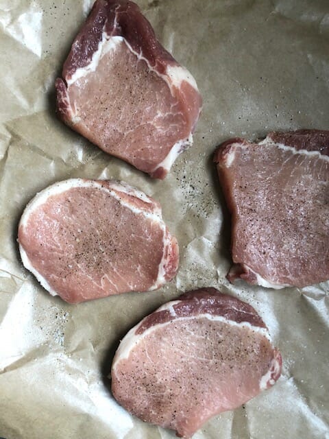 Seasoning raw boneless pork chops