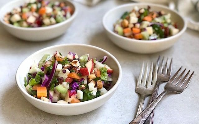 Flexible Chopped Winter Salad in bowls with forks