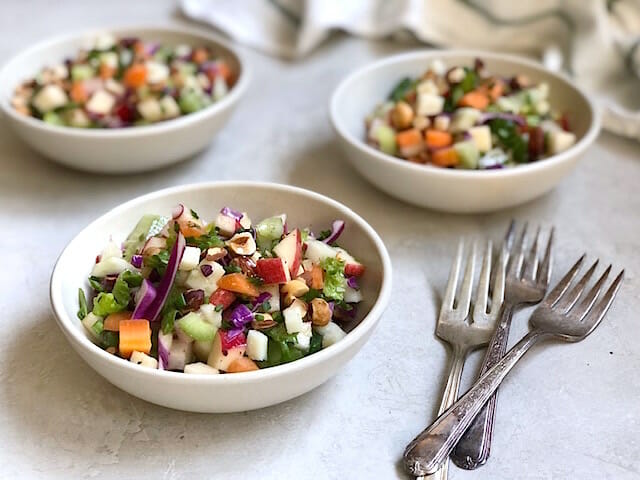 Flexible Chopped Winter Salad in bowls with forks