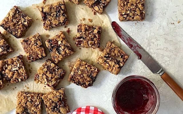 whole-grain crumble jam bars with jar of jam