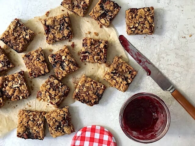 whole-grain crumble jam bars with jar of jam