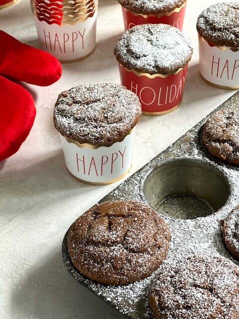 Gingerbread cupcakes in a tin with cute holiday cupcake liners          