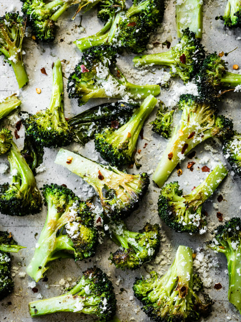 Close up of roasted broccoli on a sheet pan