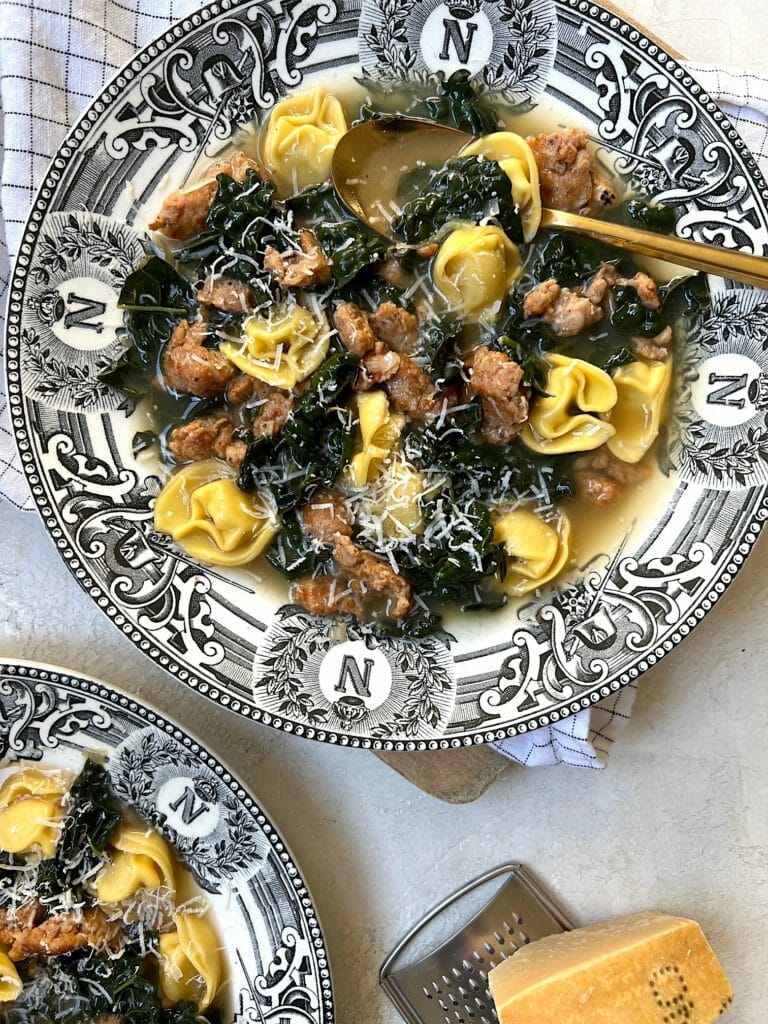 bowl of tortellini with sausage and kale
