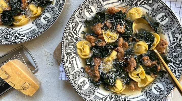bowls of brothy pasta with Parmesan